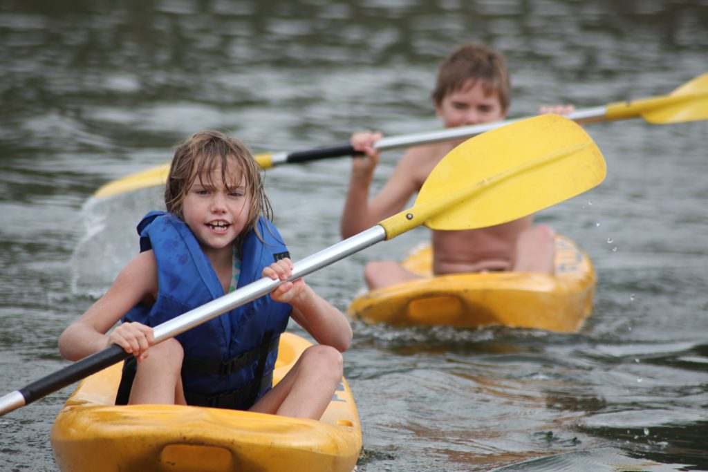 water sports branson missouri children paddling on water
